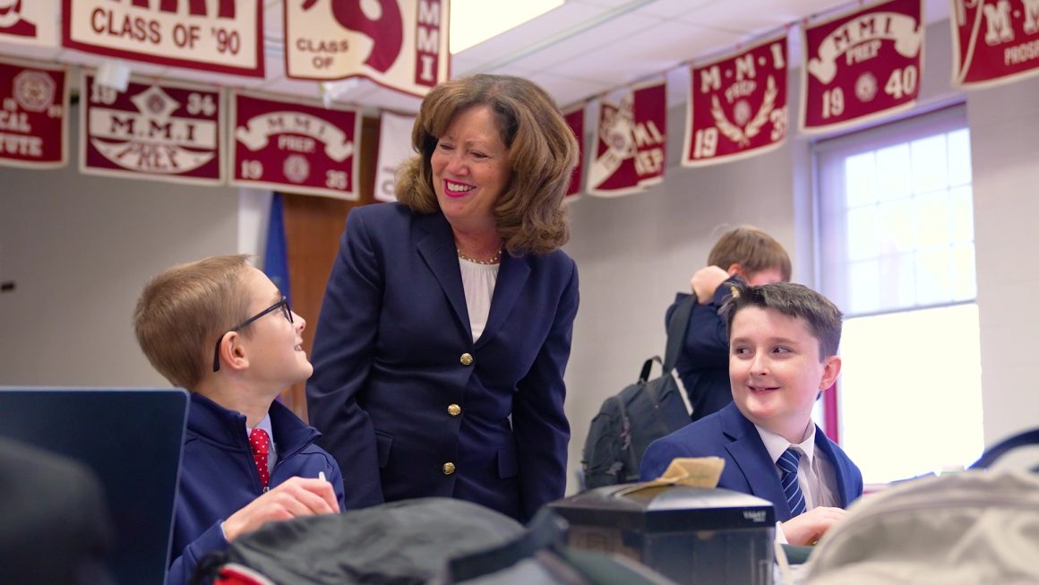 Head of School Mrs. Theresa Long talking with MMI students