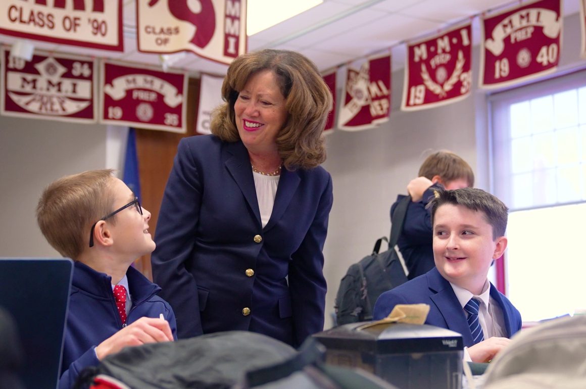 Head of School Mrs. Theresa Long talking with MMI students