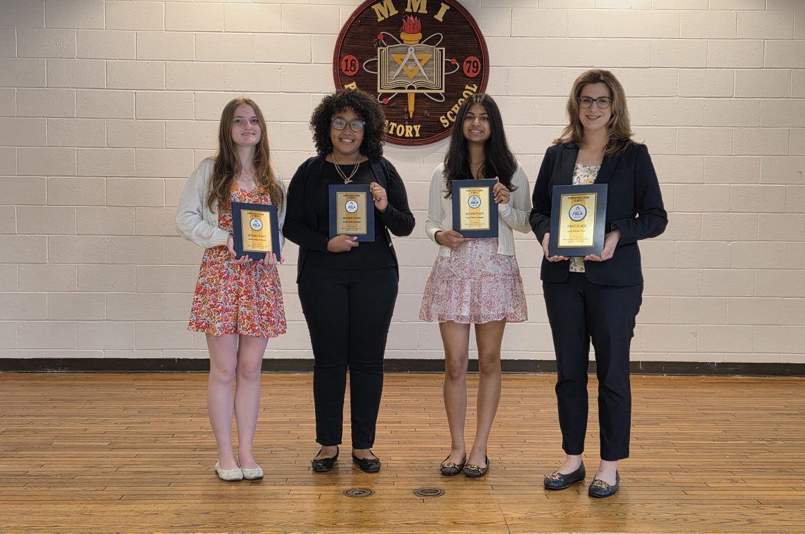 From left to right: Amanda Stoffa, Yoreimy Aponte, and Ruhani Shah stand with their advisor, Mrs. Katherine Zucco, who is holding MMI’s 1st Place Local Market Share award.
