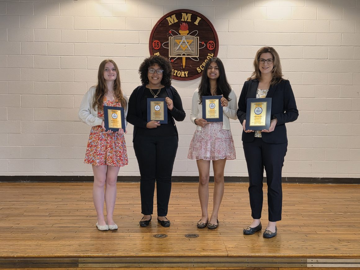 From left to right: Amanda Stoffa, Yoreimy Aponte, and Ruhani Shah stand with their advisor, Mrs. Katherine Zucco, who is holding MMI’s 1st Place Local Market Share award.