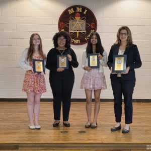 From left to right: Amanda Stoffa, Yoreimy Aponte, and Ruhani Shah stand with their advisor, Mrs. Katherine Zucco, who is holding MMI’s 1st Place Local Market Share award.